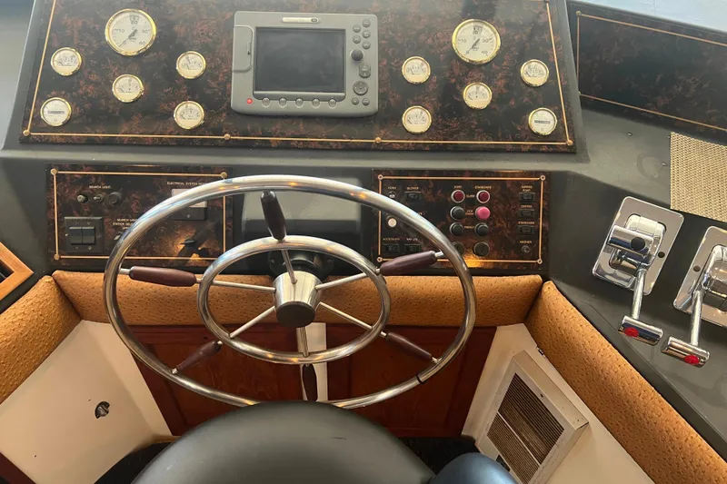 Slide: The Image of Pilothouse elm with gauges, steering wheel, and controls. - 15