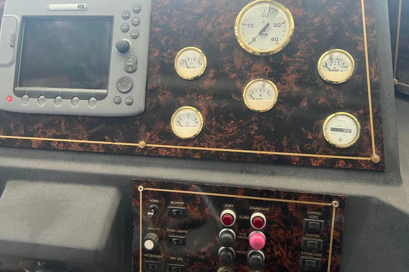 Slide: The Image of Pilothouse control panel of a 1986 Bayliner 4550 Motoryacht with gauges and navigation equipment. - 17