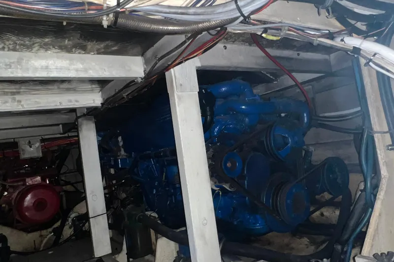 Slide: The Image of Engine room of 1986 Bayliner 4550 Motoryacht showing port engine. - 27