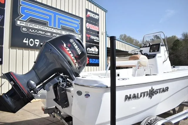 Slide: The Image of 2025 NauticStar 194 Bay boat with Yamaha engine at marine shop. - 4