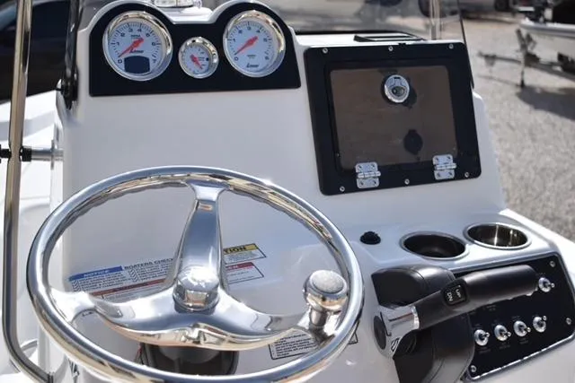 Slide: The Image of Steering console of 2025 NauticStar 194 Bay boat with gauges and controls. - 5
