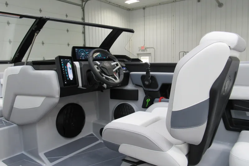Slide: The Image of 2026 Malibu Wakesetter 21 LX boat interior with modern dashboard and steering wheel. - 6