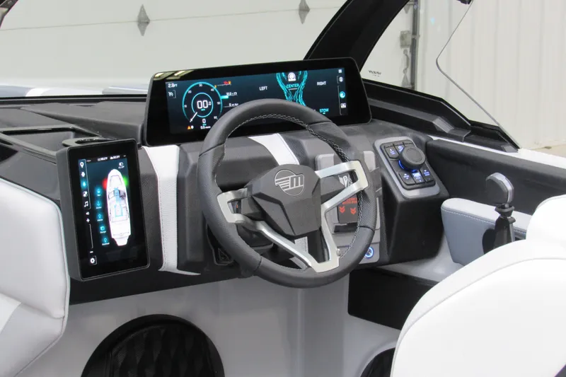Slide: The Image of 2026 Malibu Wakesetter 21 LX dashboard with modern digital displays and controls. - 7