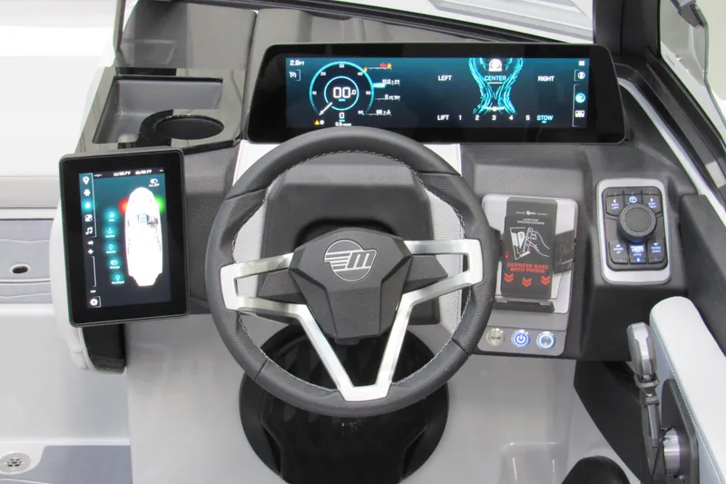 Slide: The Image of 2026 Malibu Wakesetter 21 LX dashboard with advanced digital controls and steering wheel. - 8