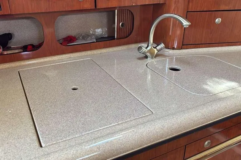Slide: The Image of 2006 Sea Ray 340 Sundancer kitchen countertop with sink and faucet. - 14