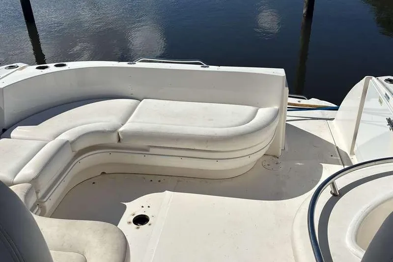 Slide: The Image of 2006 Sea Ray 340 Sundancer boat interior with white seating and water view. - 3