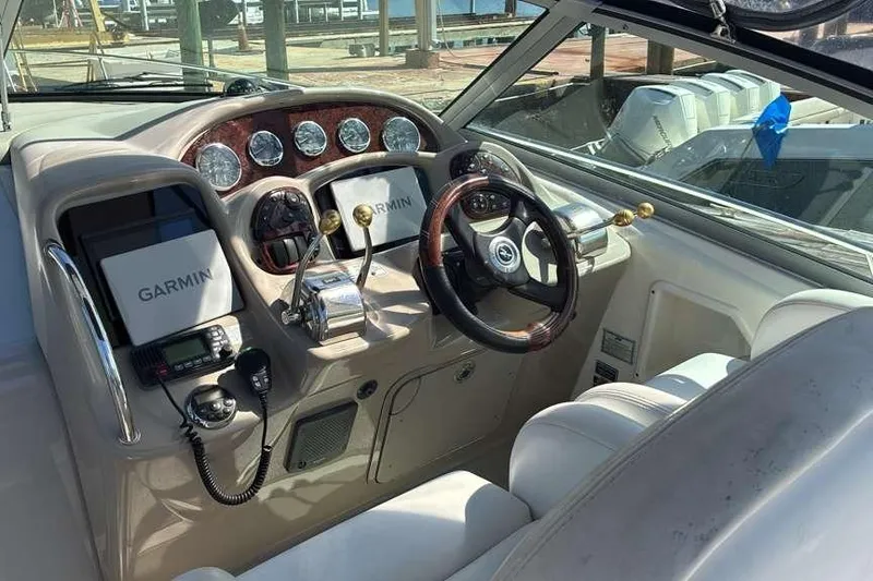 Slide: The Image of Helm of 2006 Sea Ray 340 Sundancer with Garmin navigation system and classic wood accents. - 4