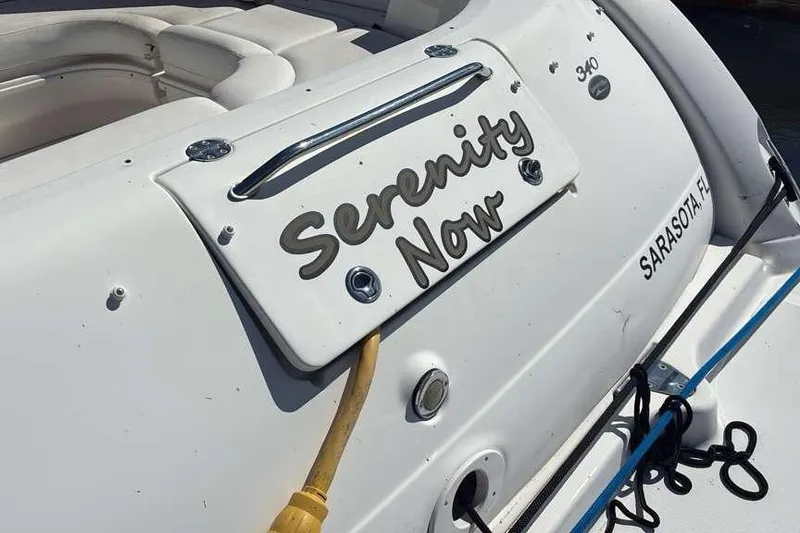 Slide: The Image of 2006 Sea Ray 340 Sundancer boat with "Serenity Now" nameplate, docked in Sarasota, FL. - 5