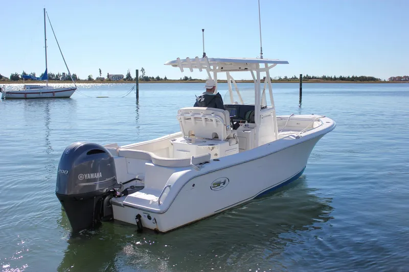 The Image of 2020 Sea Hunt Ultra 234 boat with Yamaha engine on calm water. - 0