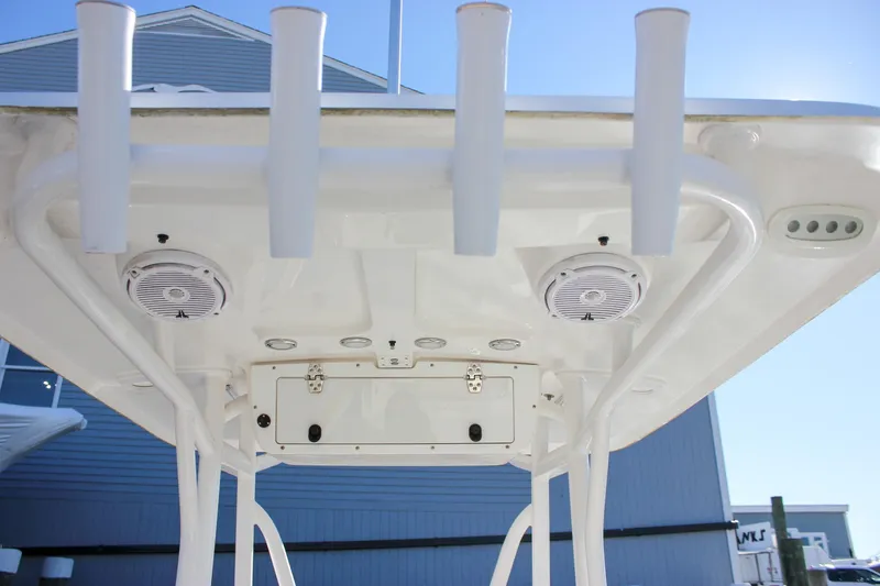 Slide: The Image of Interior view of 2020 Sea Hunt Ultra 234 boat, featuring white seating and cup holder. - 15