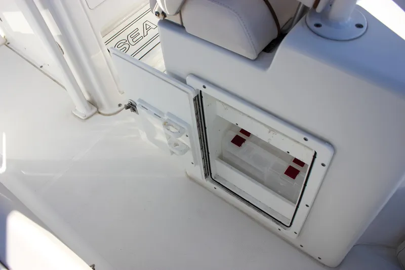 Slide: The Image of 2020 Sea Hunt Ultra 234 boat interior ceiling with speakers and rod holders. - 19