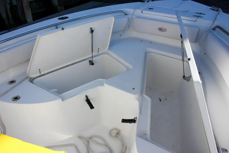 Slide: The Image of 2020 Sea Hunt Ultra 234 boat console with Garmin navigation system and steering wheel. - 24