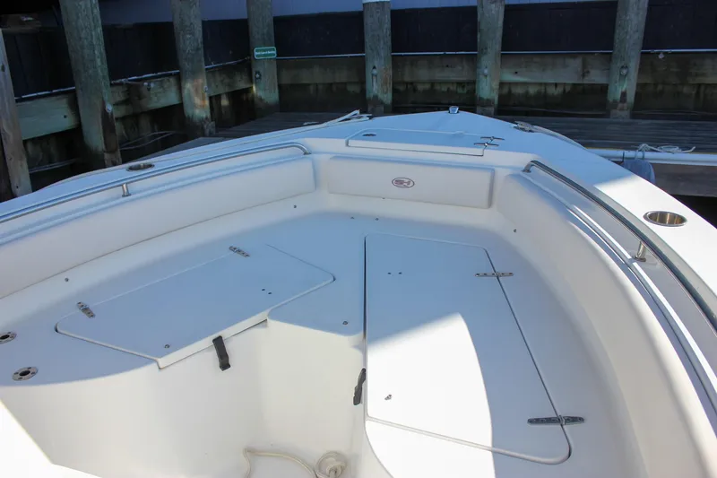 Slide: The Image of 2020 Sea Hunt Ultra 234 boat storage compartment with safety features. - 25