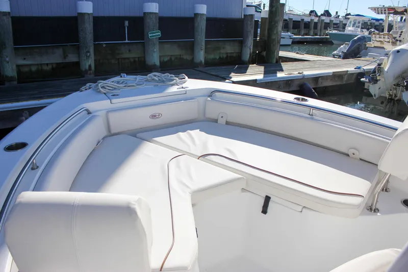Slide: The Image of 2020 Sea Hunt Ultra 234 boat, viewed from below, showcasing its sturdy T-top structure. - 32