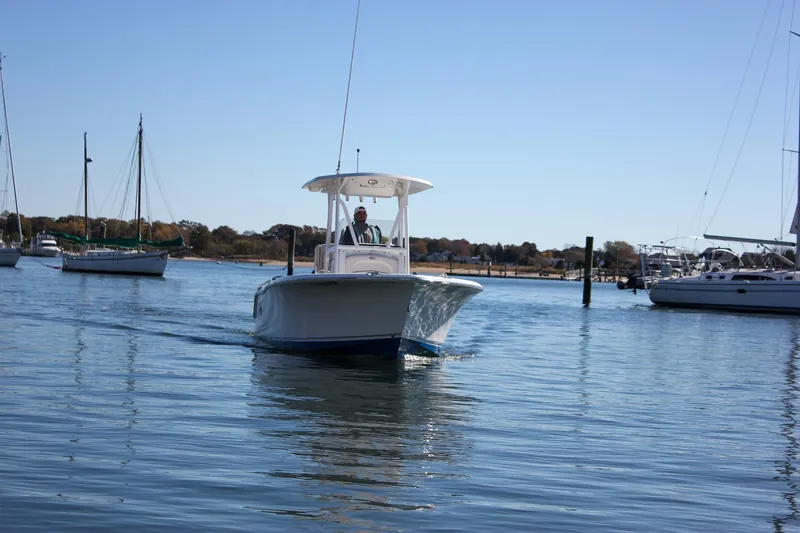 Slide: The Image of 2020 Sea Hunt Ultra 234 boat interior with storage compartment and seating. - 39