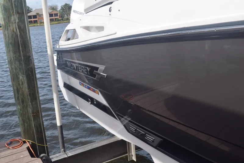 Slide: The Image of 2025 Monterey 275SS Super Sport boat docked by the water. - 10