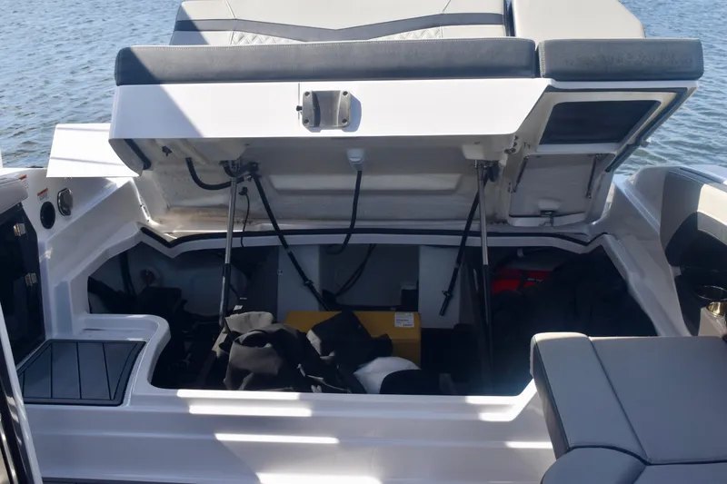 Slide: The Image of Open storage compartment on 2025 Monterey 275SS Super Sport boat, revealing interior space. - 101