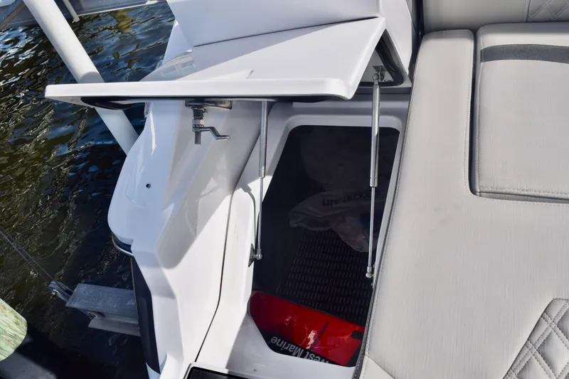 Slide: The Image of 2025 Monterey 275SS Super Sport boat storage compartment with open hatch. - 111