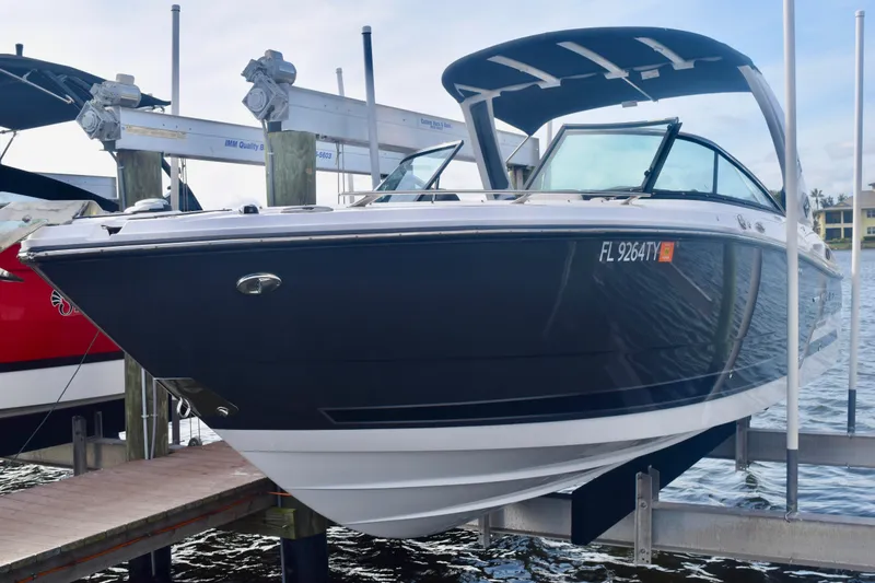 Slide: The Image of 2025 Monterey 275SS Super Sport boat docked at marina, side view. - 20