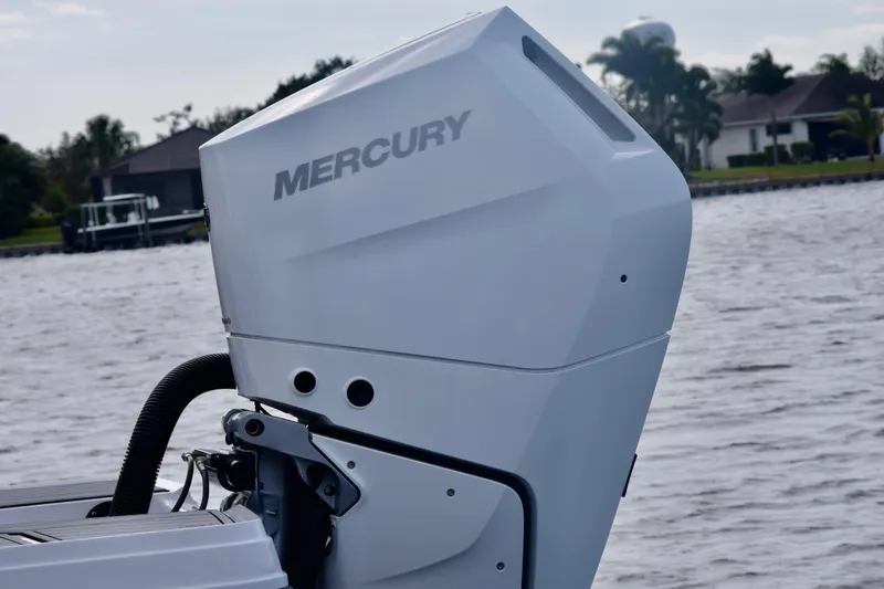 Slide: The Image of 2025 Monterey 275SS Super Sport with Mercury outboard engine on a scenic waterway. - 26