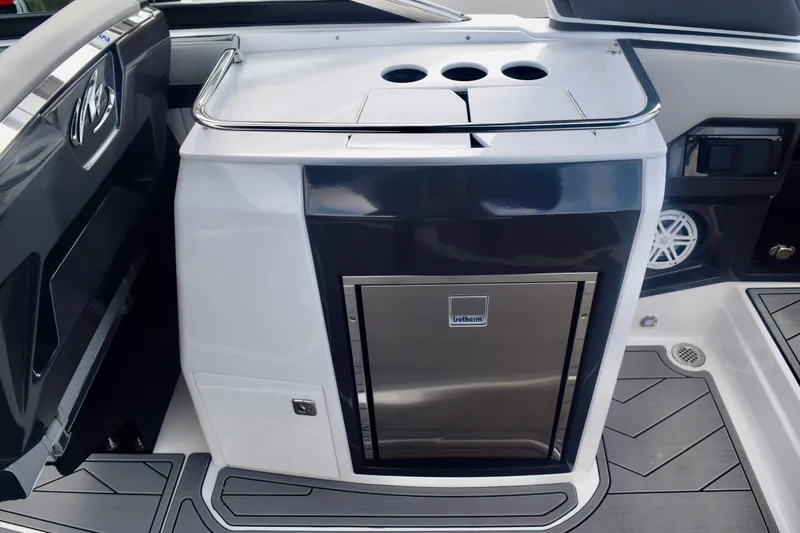 Slide: The Image of 2025 Monterey 275SS Super Sport boat interior with sleek kitchenette and modern design. - 38