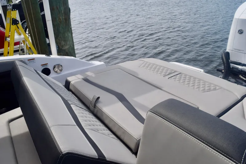 Slide: The Image of 2025 Monterey 275SS Super Sport boat with sleek seating and water backdrop. - 48