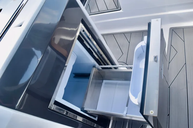Slide: The Image of Open storage compartment on 2025 Monterey 275SS Super Sport boat, showcasing sleek design. - 50
