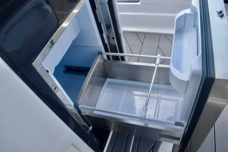 Slide: The Image of Open drawer in 2025 Monterey 275SS Super Sport boat, showcasing sleek interior design. - 51