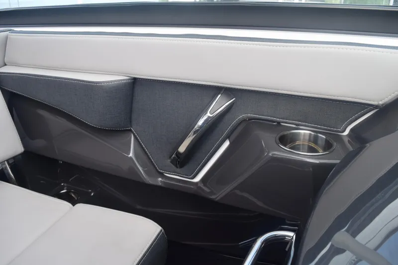 Slide: The Image of Interior of 2025 Monterey 275SS Super Sport boat with sleek design and cup holder. - 59