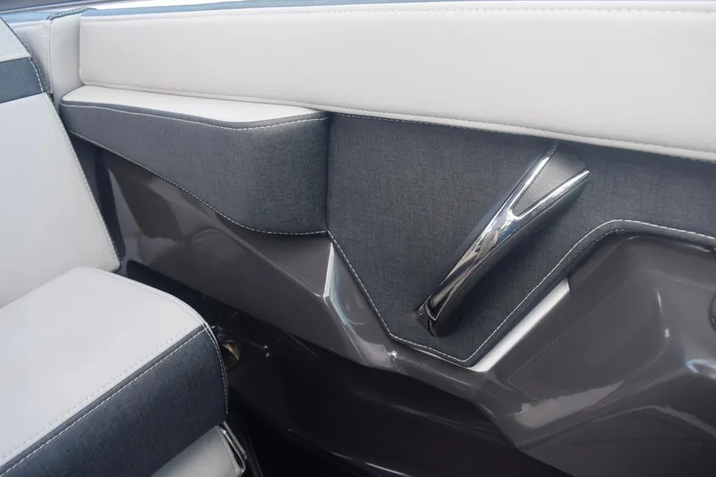 Slide: The Image of Interior detail of 2025 Monterey 275SS Super Sport boat, featuring sleek upholstery and chrome accents. - 67