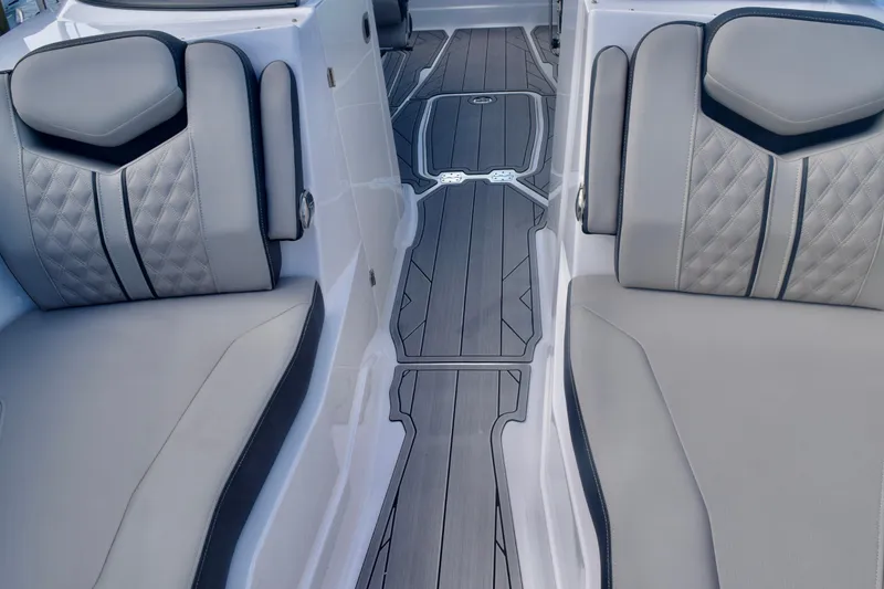 Slide: The Image of 2025 Monterey 275SS Super Sport boat interior with luxurious seating and sleek flooring design. - 72