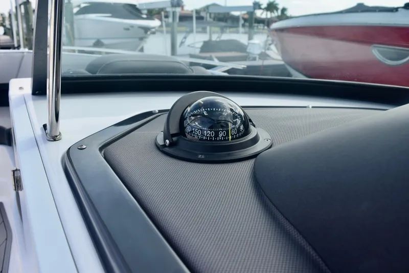 Slide: The Image of Compass on 2025 Monterey 275SS Super Sport boat dashboard at marina. - 75