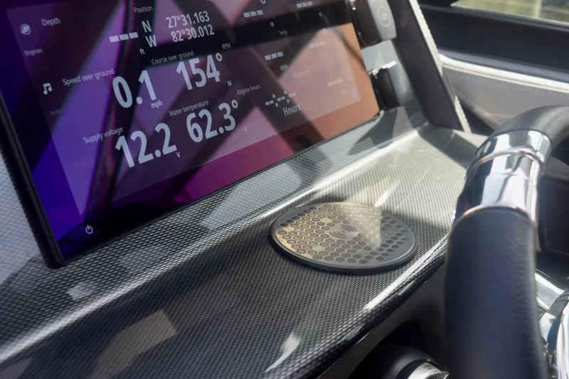 Slide: The Image of Dashboard of 2025 Monterey 275SS Super Sport boat with digital display and steering wheel. - 78