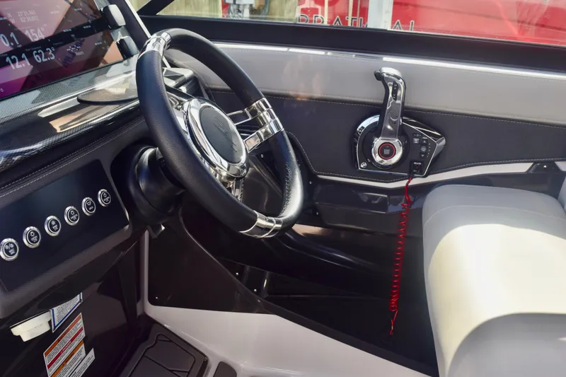 Slide: The Image of 2025 Monterey 275SS Super Sport boat cockpit with steering wheel and control panel. - 80