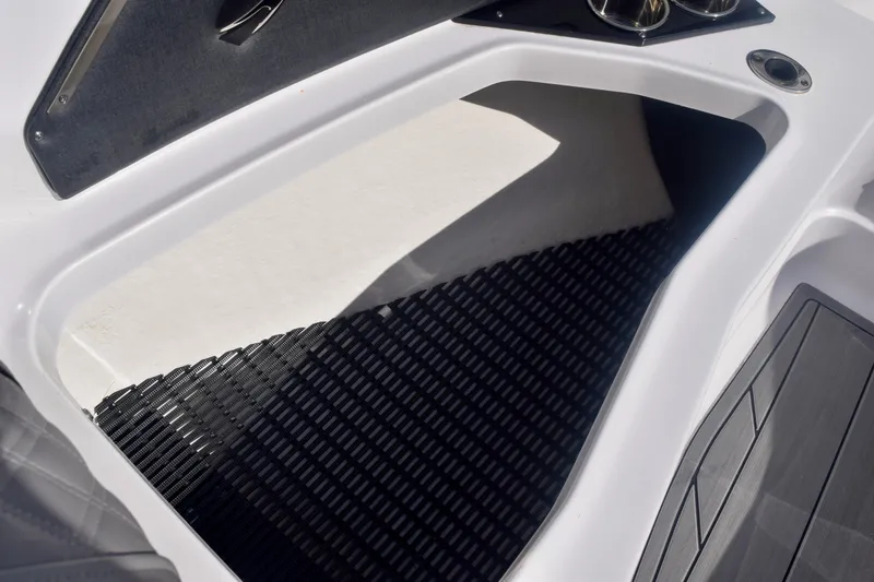 Slide: The Image of 2025 Monterey 275SS Super Sport boat interior with sleek design and cup holders. - 84