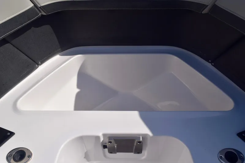 Slide: The Image of 2025 Monterey 275SS Super Sport boat interior seating area, featuring sleek design and comfortable upholstery. - 85