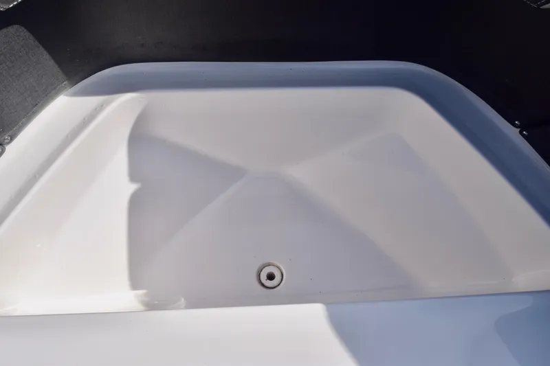 Slide: The Image of 2025 Monterey 275SS Super Sport boat interior detail, featuring a sleek white compartment. - 88