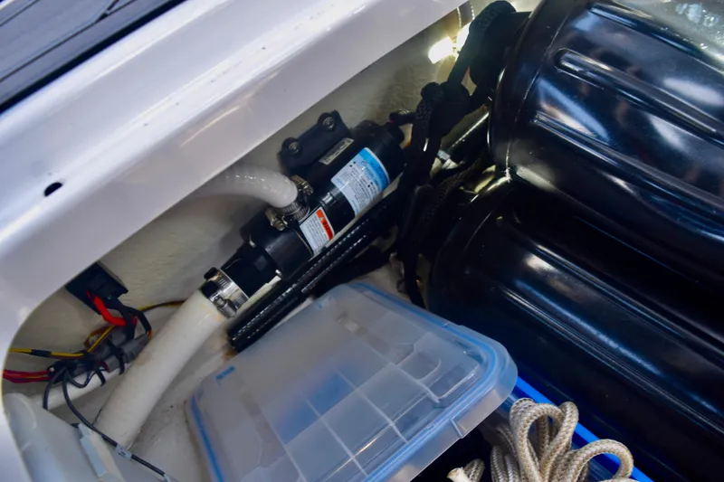 Slide: The Image of Storage compartment of 2025 Monterey 275SS Super Sport boat with equipment and ropes. - 92