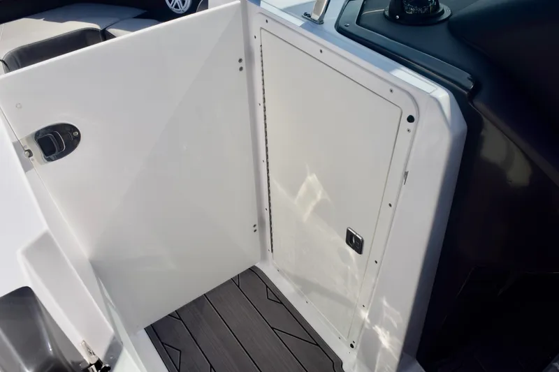 Slide: The Image of 2025 Monterey 275SS Super Sport boat interior with sleek white panel and modern design. - 99