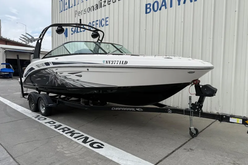 Slide: The Image of 2018 Chaparral Vortex 2430 VRX boat on trailer, parked outside dealership. - 1