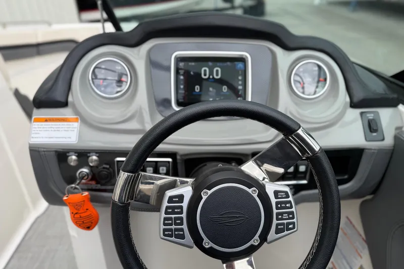 Slide: The Image of Steering wheel and dashboard of 2018 Chaparral Vortex 2430 VRX boat. - 11
