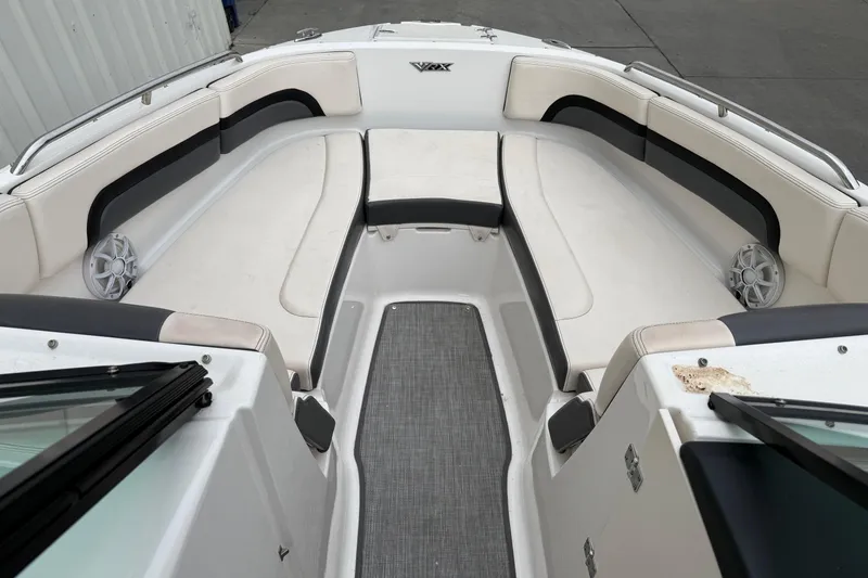 Slide: The Image of 2018 Chaparral Vortex 2430 VRX boat interior with white seating and speakers. - 12