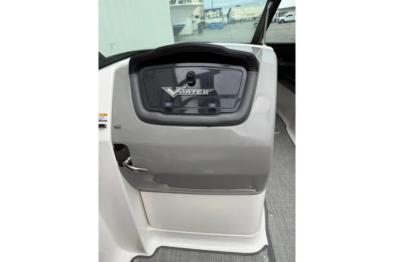 Slide: The Image of 2018 Chaparral Vortex 2430 VRX dashboard with sleek design and logo detail. - 20