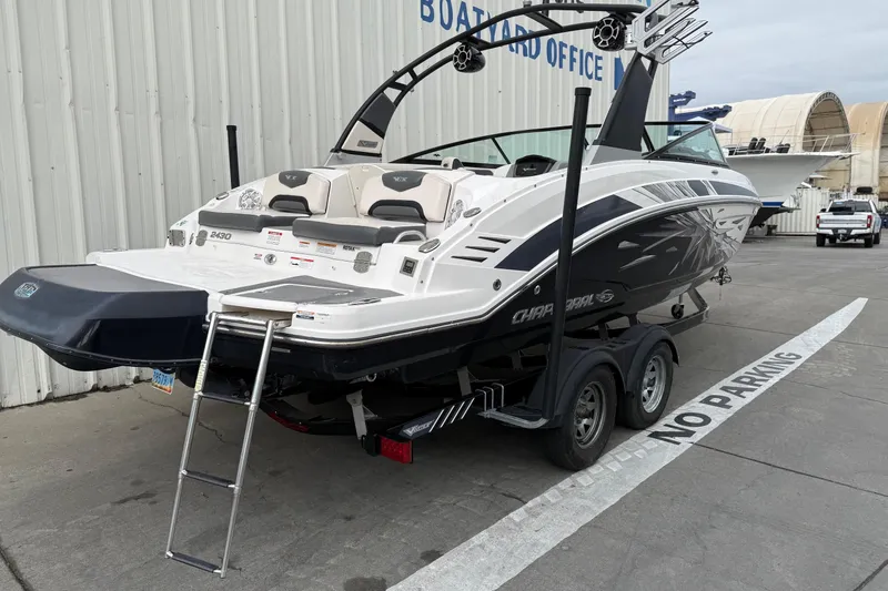 Slide: The Image of 2018 Chaparral Vortex 2430 VRX boat on trailer, parked near boatyard office. - 7