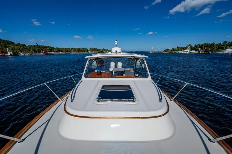 Slide: The Image of 2024 Hinckley 35 yacht cruising on a sunny day with clear blue skies. - 25