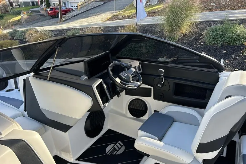 Slide: The Image of 2024 Malibu Wakesetter 22 LSV interior with sleek dashboard and modern steering wheel design. - 9