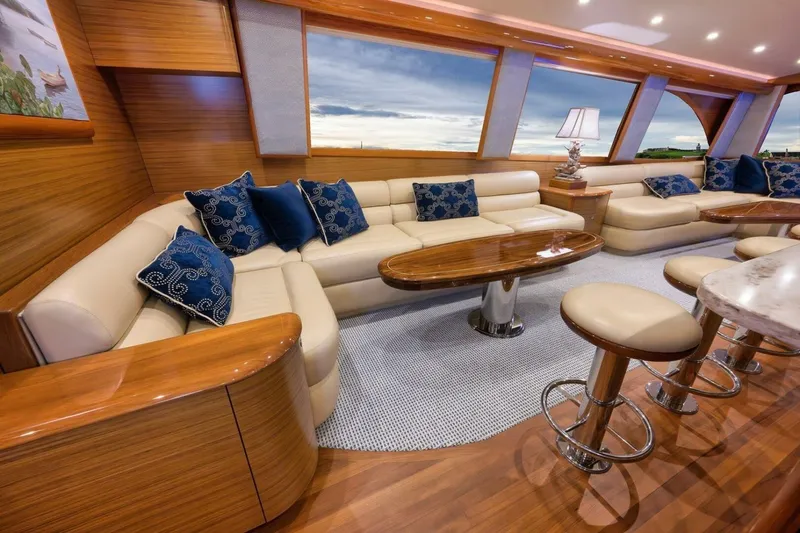 Slide: The Image of Luxurious yacht interior with plush seating, wooden accents, and ocean view through large windows. Weaver 2012. - 11