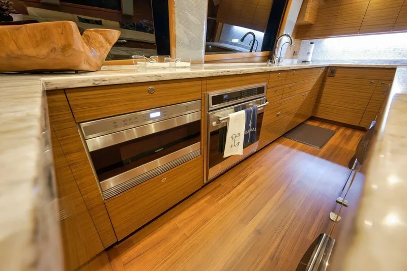 Slide: The Image of Luxurious Weaver custom kitchen, 2012 model, featuring wood cabinetry and modern appliances. - 12