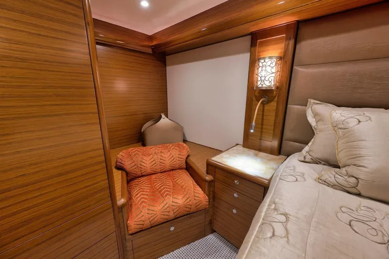 Slide: The Image of Luxurious Weaver custom yacht bedroom interior, featuring elegant wood paneling and plush bedding, 2012 model. - 17