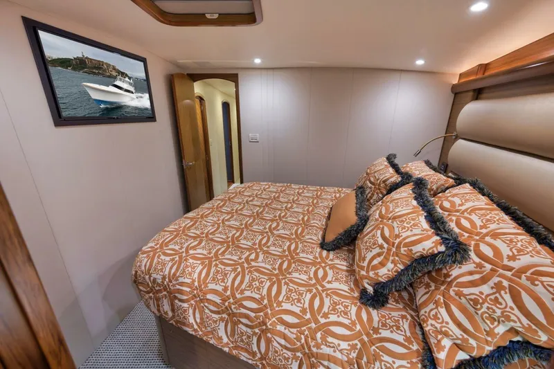 Slide: The Image of Luxurious Weaver custom yacht bedroom, 2012 model, with elegant bedding and framed boat picture. - 25